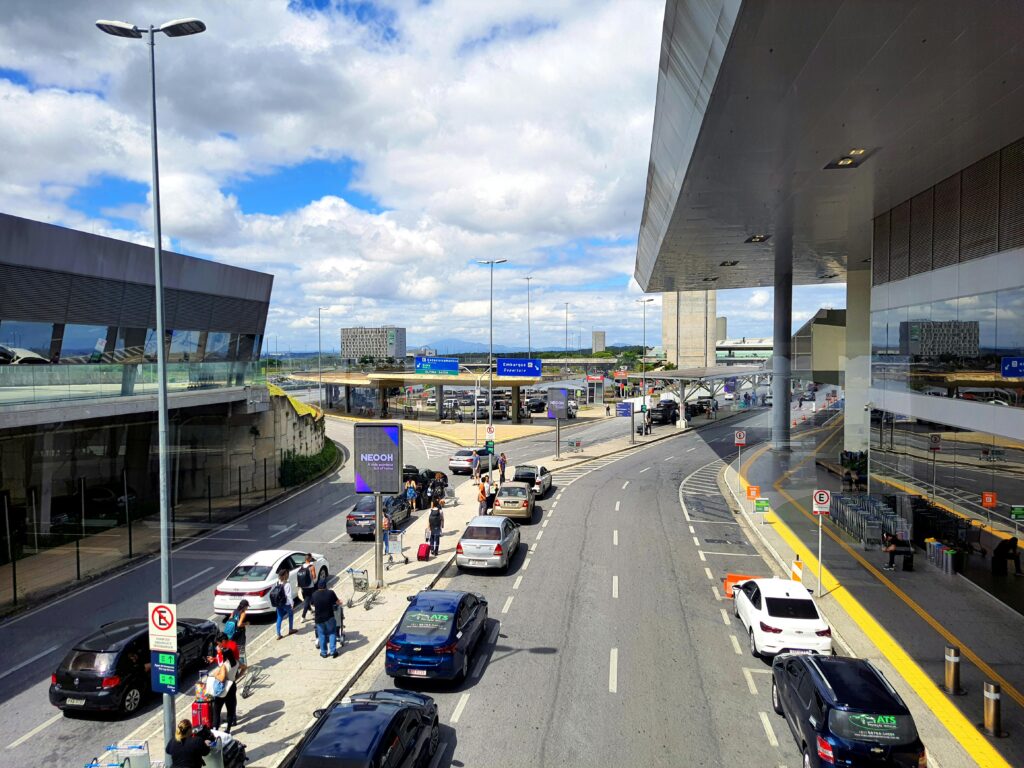pexels-photo-23414612-23414612 A bustling scene at the entrance of Tancredo Neves International Airport in Belo Horizonte, Brazil.